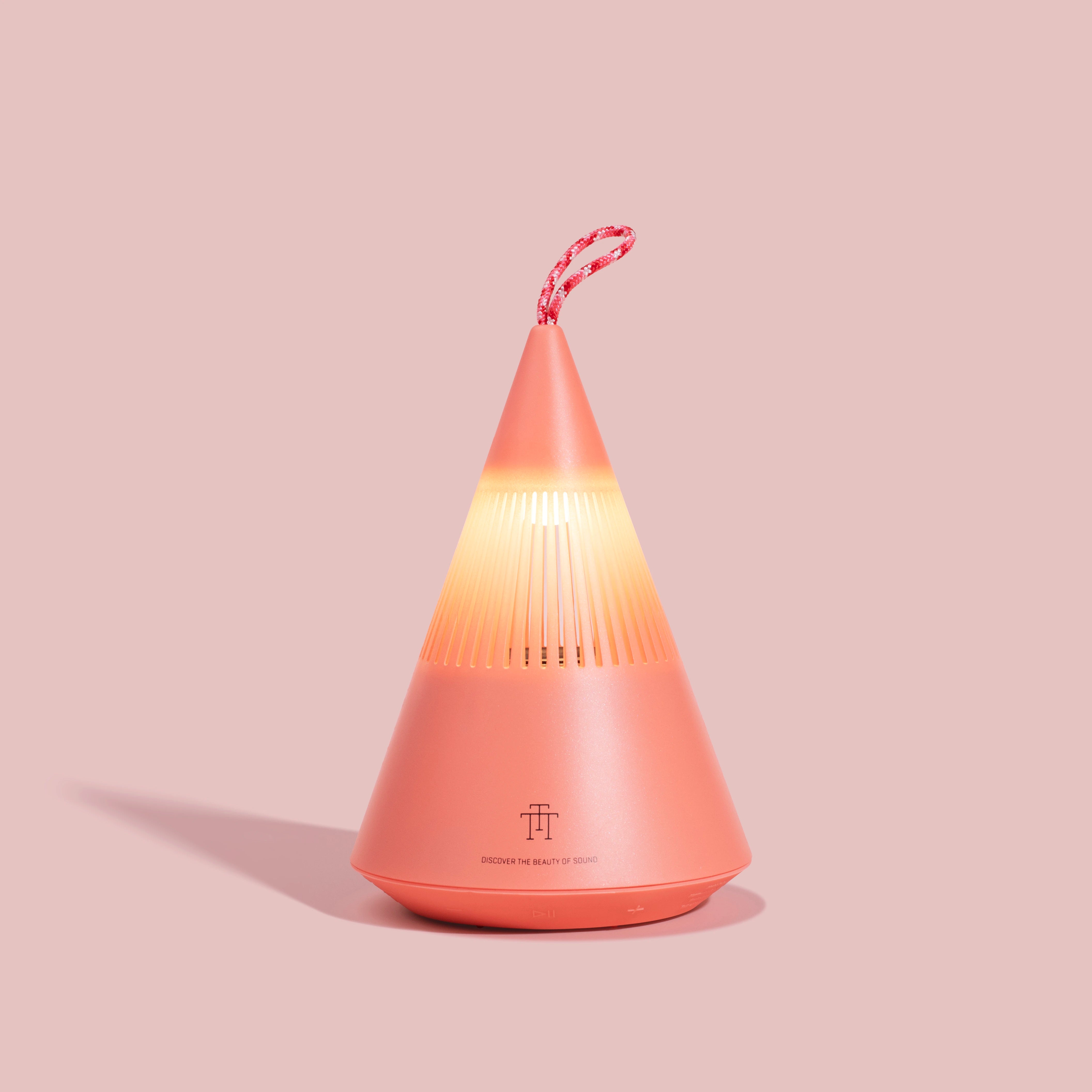 TreSound Q outdoor Bluetooth speaker in Majestic Cloud Red with ambient light and modern portable design