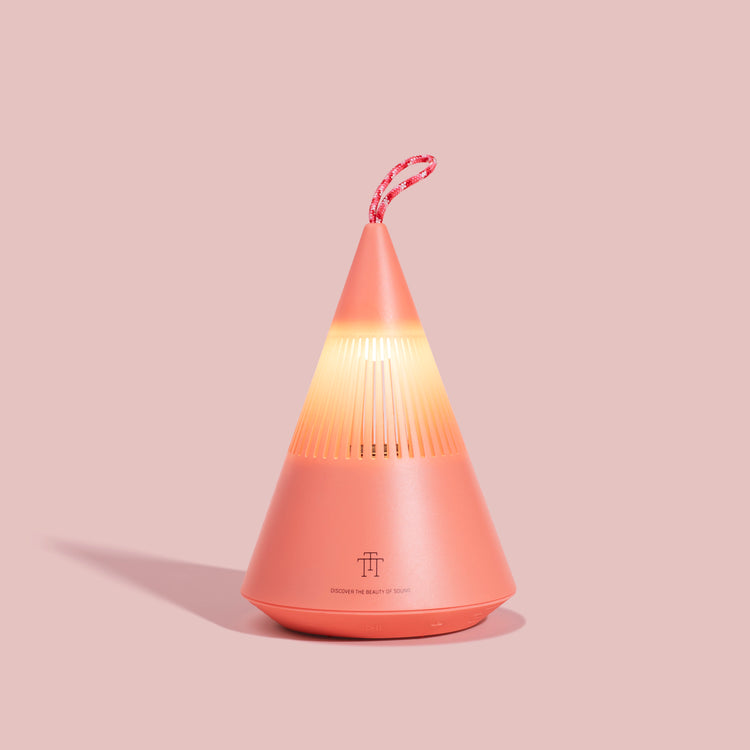 TreSound Q outdoor Bluetooth speaker in Majestic Cloud Red with ambient light and modern portable design