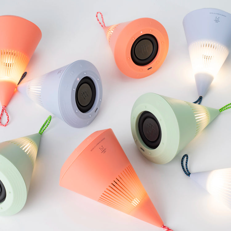 TreSound Q outdoor Bluetooth speaker Majestic Cloud Red with multiple color versions in modern interior setting